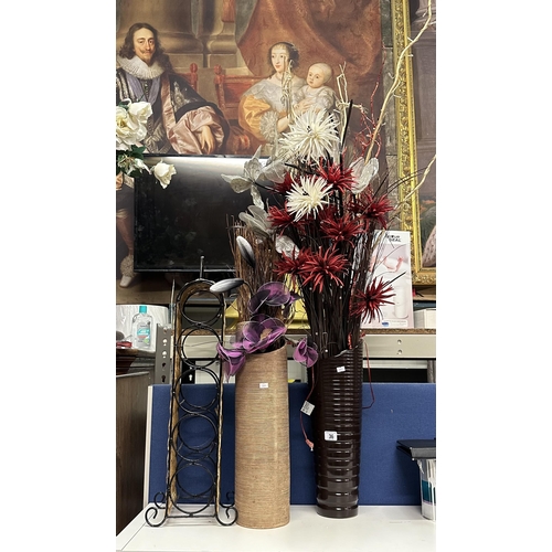 36 - TWO VASES CONTAINING FAUX FLOWERS AND WICKER AND WROUGHT IRON WINE RACK