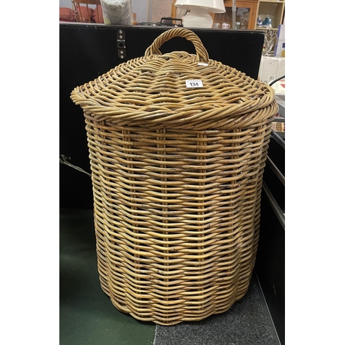 134 - LARGE WICKER LAUNDRY BASKET