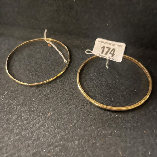 174 - TWO GOLD COLOURED BANGLES