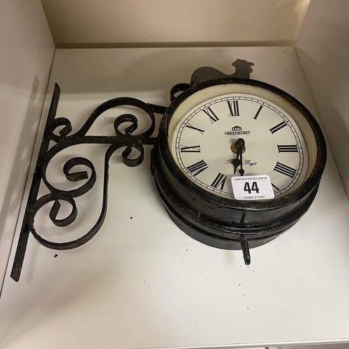 44 - WROUGHT IRON WALL MOUNTED CLOCK ON ORNATE BRACKET