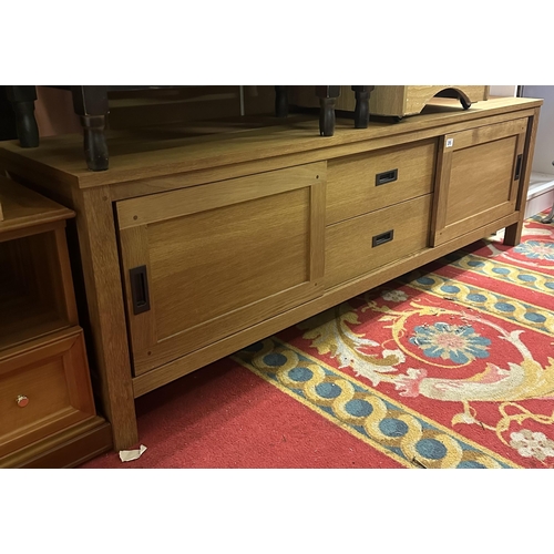 315 - OAK LOW SIDEBOARD WITH DOUBLE DRAWER AND SLIDING CUPBOARDS