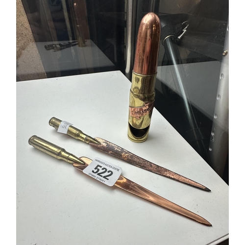 522 - TWO COPPER AND BRASS LETTER OPENERS AND AN AFRICAN BULLETT