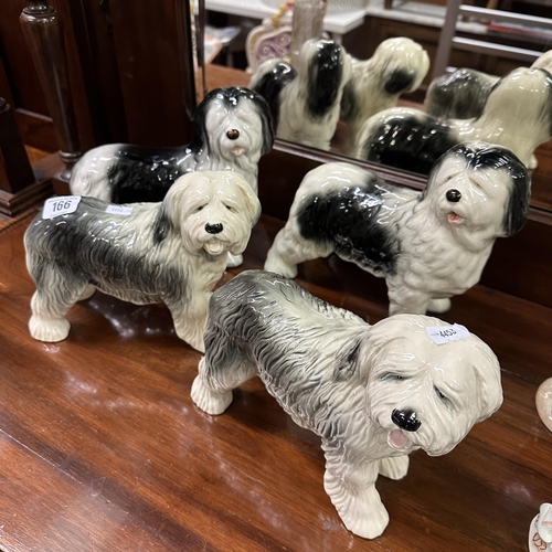 166 - TWO MATCHING PAIRS OF PORCELAIN DOGS