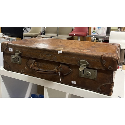 19 - EARLY LEATHER SUITCASE WITH LEATHER STUDDED CORNERS