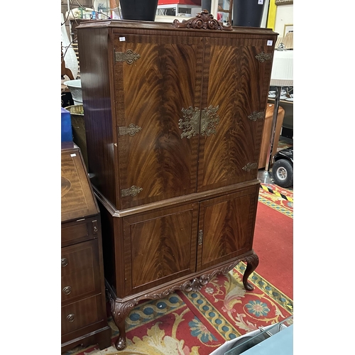 12 - FLAME MAHOGANY COCKTAIL CABINET WITH STUNNING INTERIOR AND ENGRAVED BRASS WORK HINGES AND ESCUTCHEON... 