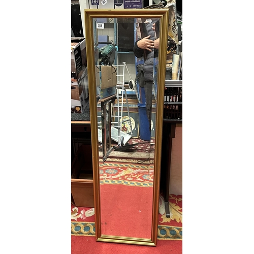 388 - LONG BEVELLED GLASS DRESSING/ HALL MIRROR IN GILT FRAME