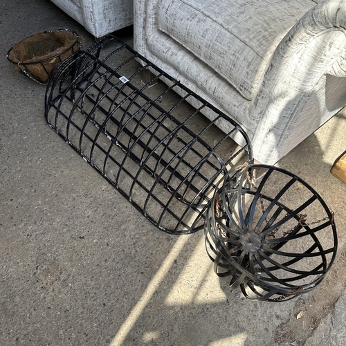 1196 - TWO WROUGHT IRON HAY RACKS AND THREE HANGING BASKETS