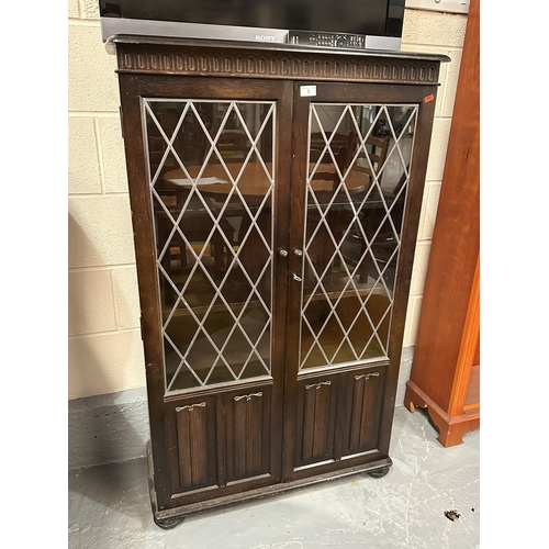 3 - OAK LINEN FOLD FRONTED LEADED GLASS BOOKCASE