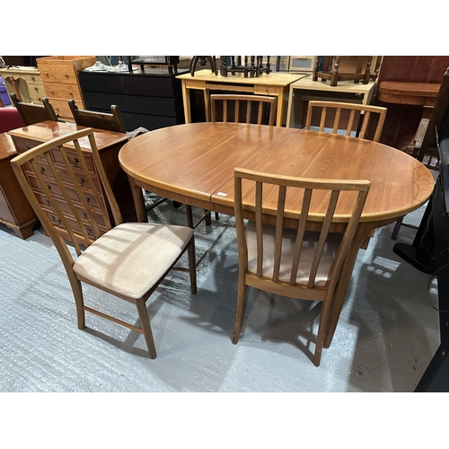 47 - TEAK G-PLAN EXTENDING DINING TABLE AND FOUR CHAIRS