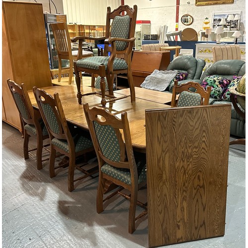 14 - OAK EXTENDING DINING TABLE WITH THREE EXTENSIONS AND FIVE CHAIRS, ONE CARVER