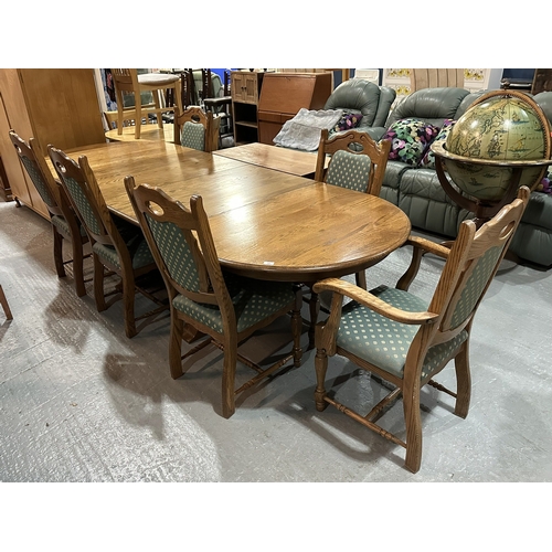 14 - OAK EXTENDING DINING TABLE WITH THREE EXTENSIONS AND FIVE CHAIRS, ONE CARVER