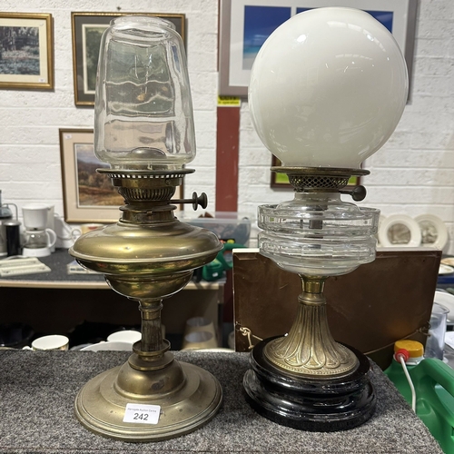 242 - 2 EARLY BRASS LAMPS