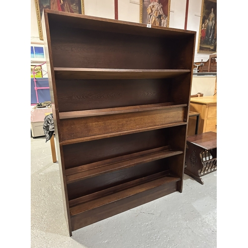 304 - A PAIR OF OAK SLOPED SHELF BOOKCASES