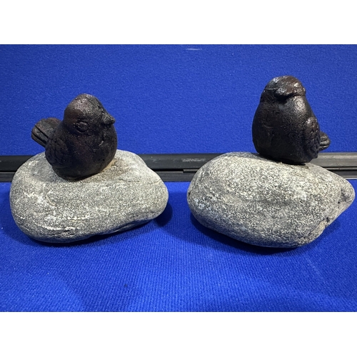 214 - CAST IRON BIRDS ON STONE GARDEN ORNAMENTS