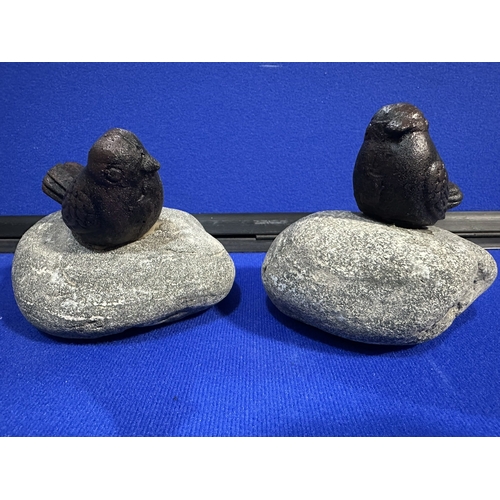 218 - CAST IRON BIRDS ON STONE GARDEN ORNAMENTS