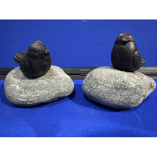 219 - CAST IRON BIRDS ON STONE GARDEN ORNAMENTS