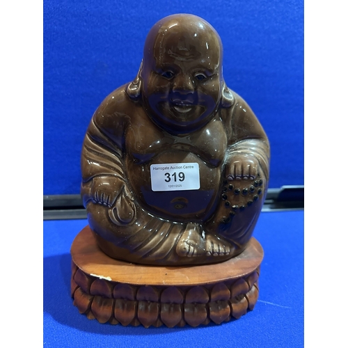 319 - INDIAN CERAMIC BUDDHA ON WOODEN PLINTH 9” TALL