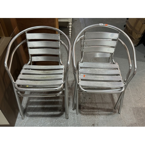 53 - FOUR ALUMINIUM STACKING CHAIRS