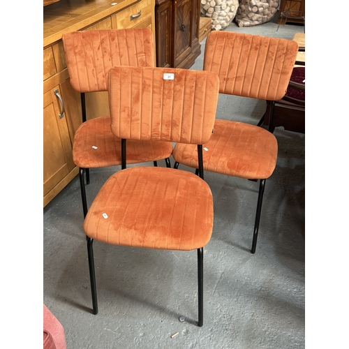 31 - THREE CONTEMPORARY ORANGE FABRIC CHAIRS