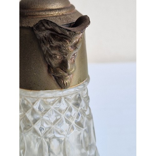 62 - CRYSTAL AND BRASS SHIPS DECANTER AND CLARET JUG WITH MASKED SPOUT