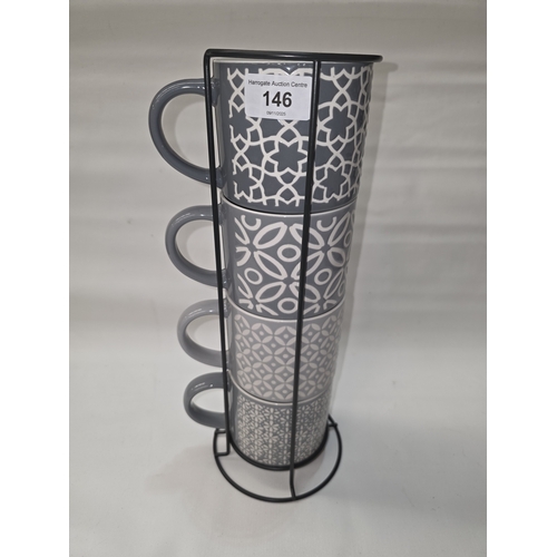 146 - SET OF FOUR JUMBO EMBOSSED STACKING MUGS