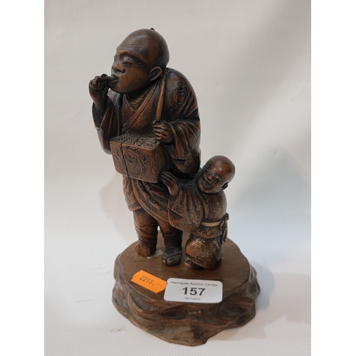 157 - EARLY ANTIQUE ORIENTAL WOODEN CARVED FIGURE OF MAN AND BOY ON WOODEN PLINTH, 7.5” TALL