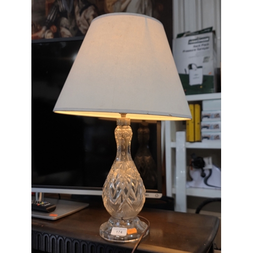 174 - A BEAUTIFUL CRYSTAL BASE VASE WITH CREAM LAMPSHADE