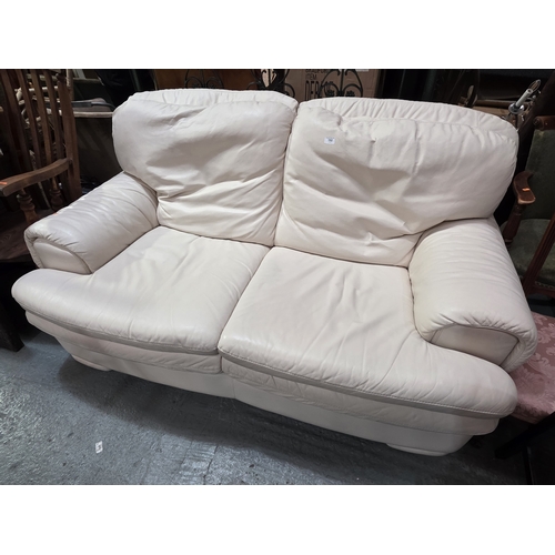 43 - CREAM LEATHER THREE SEATER SOFA