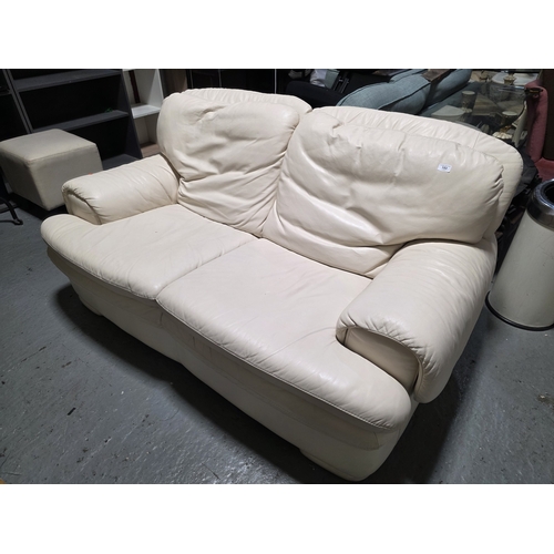 43 - CREAM LEATHER THREE SEATER SOFA