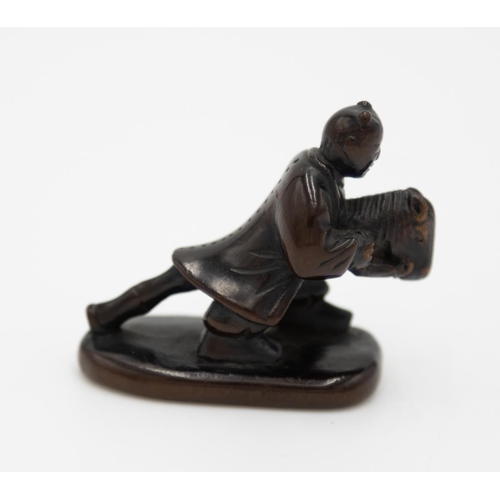 181 - Title: Wood netsuke of a karako (Chinese boy) playing with a harukoma (hobby horse)
Date: 19th centu... 