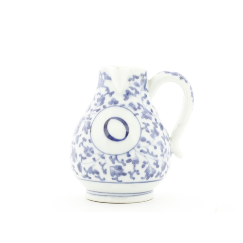 96 - Title: Blue and White Imari Oil Ewer
Date: Early 18th Century
Dimensions: 8.5 x 10.4 x 9.3 (includin... 