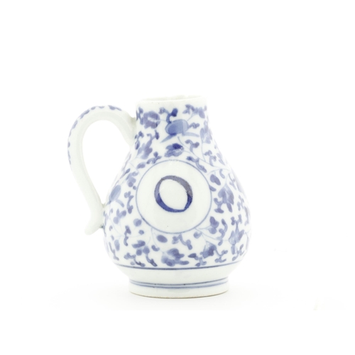 96 - Title: Blue and White Imari Oil Ewer
Date: Early 18th Century
Dimensions: 8.5 x 10.4 x 9.3 (includin... 