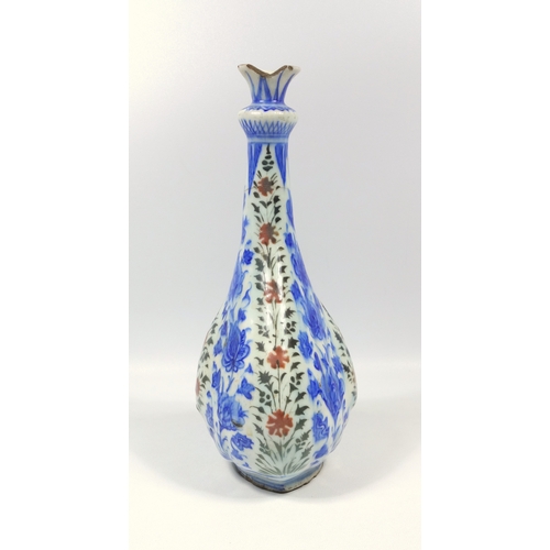 155 - ANTIQUE PERSIAN TIN GLAZED BOTTLE SHAPED VASE WITH PAINTED BLUE AND RED FLORAL DECORATION, A TAPERIN... 