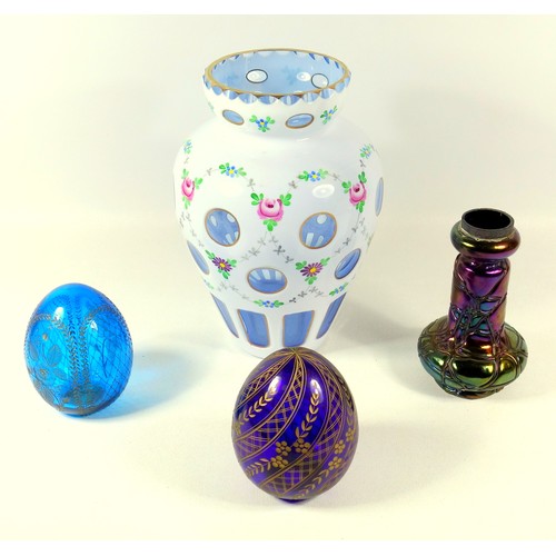 187 - Bohemian white cased glass vase painted with rosebuds (H. 21 cm), two gilt painted eggs and an Austr... 