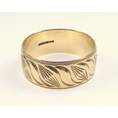 16 - Gold wedding band with abstract leaf form pattern, marks for 9 ct, 6.4 grams, large size 70 mm circu... 