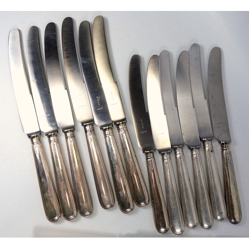 452 - Large selection of cutlery to include silver handle dinner and bread knives, c. 1971, sets of Sheffi... 