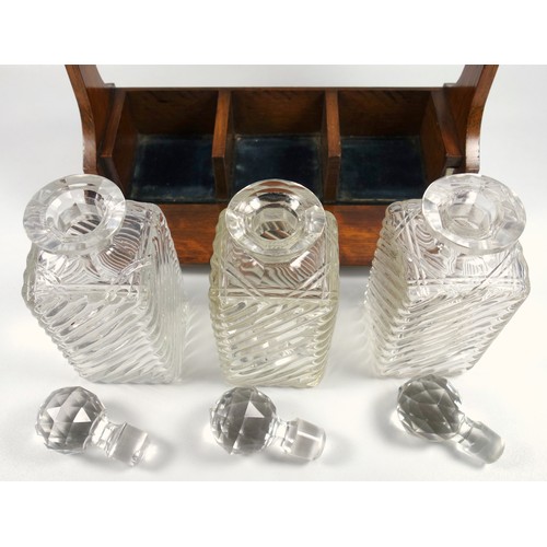 479 - Late Victorian oak tantalus with silver plated mounts and three wrythen and cut glass decanters, (wi... 