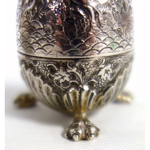 438 - Two Indian silver egg form salts, finely engraved with hunting scene, on claw feet and a small waist... 