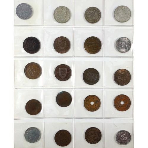 70 - Album containing 14 sheets of coins, British, Colonial and other silver and copper coins of the worl... 