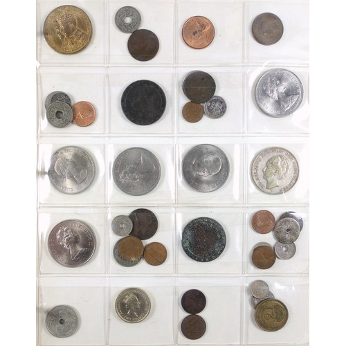 70 - Album containing 14 sheets of coins, British, Colonial and other silver and copper coins of the worl... 