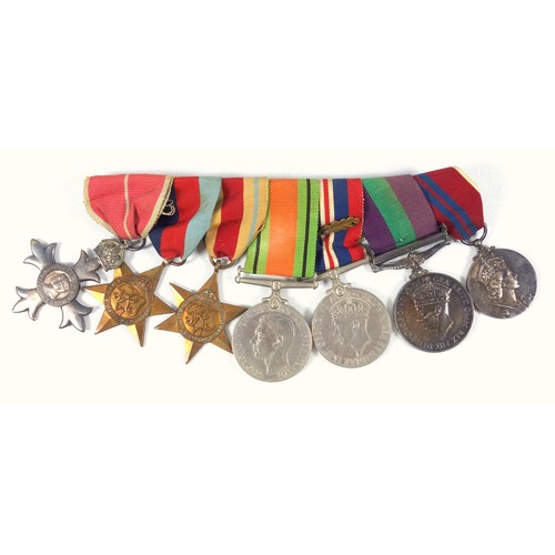 103 - Group of 7 WWII medals comprising the MBE, 1939-45 and African Stars, Defence and War medals, Genera... 