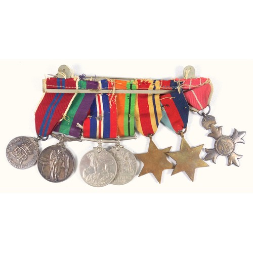 103 - Group of 7 WWII medals comprising the MBE, 1939-45 and African Stars, Defence and War medals, Genera... 