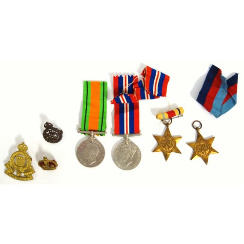 109 - World War II, 1939-45 star and Africa Star, Defence and War medals, belt with 9 badges, 3 other badg... 