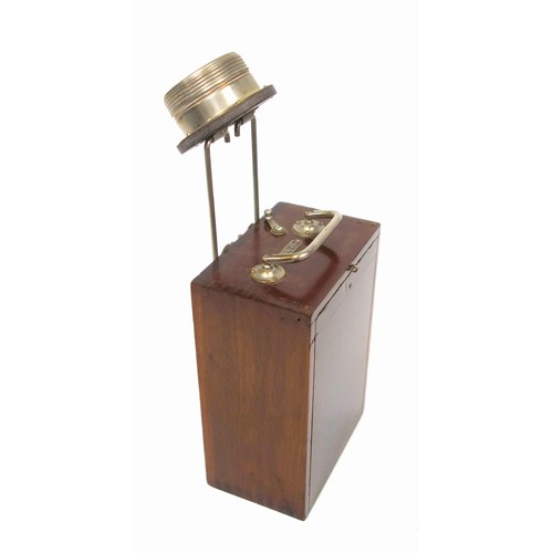 123 - Eveready adjustable carrying lamp with folding handle and “The Flag” dry cell battery, in a mahogany... 