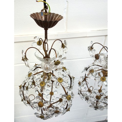 136 - Pair of gilt lacquered spherical ceiling lights with faceted glass floral decoration, H 38cm (2)