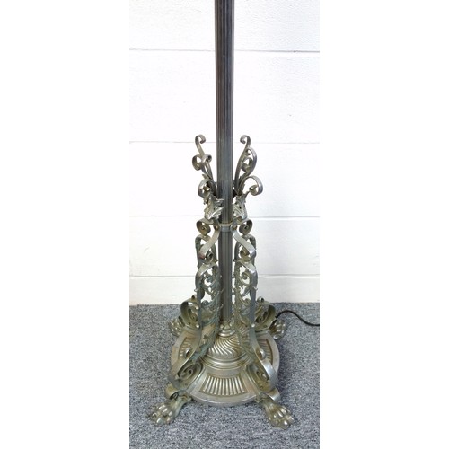 141 - Chromed metal standard lamp with a reeded and adjustable column, scroll and floral decoration, on a ... 