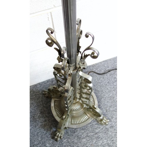 141 - Chromed metal standard lamp with a reeded and adjustable column, scroll and floral decoration, on a ... 