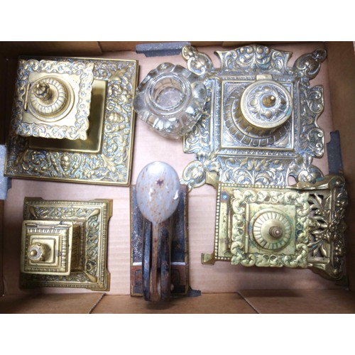 148 - Four Victorian brass inkwells, a glass well and a letter punch (6)