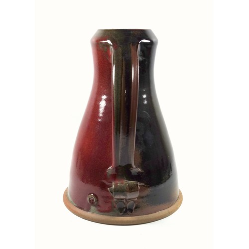 190 - Mike Braisher large stoneware jug with red and brown glaze and scroll handle, impressed mark, 35 cm