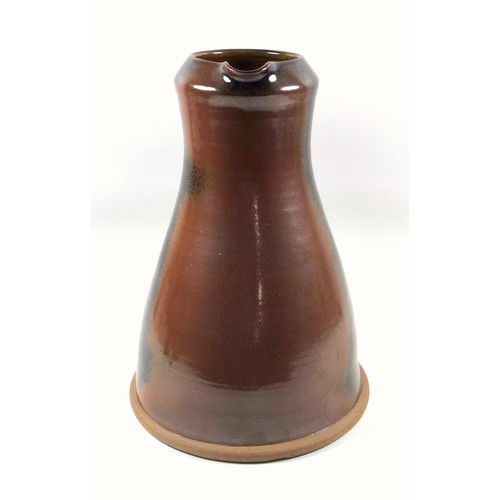 190 - Mike Braisher large stoneware jug with red and brown glaze and scroll handle, impressed mark, 35 cm